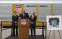 <a href="/newsinfo/graphics/media_kit/autoflex/af_speakers.jpg">High-Res Version</a><br>Missouri Gov. Jay Nixon talks to the more than 200 De Soto car shop employees gathered to unveil the AutoFlex rail car. Sharing the stage with the Gov. were Ben Jones (left), director public affairs for Missouri and Kansas and Bob Turner (right) sr. vice president – Corporate Communications.